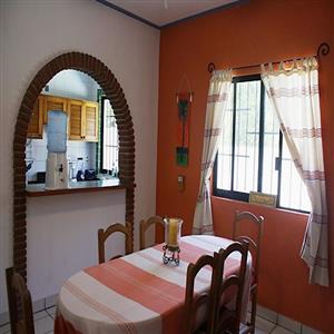 Dining room with kitchen pass-thru.