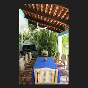Covered dining area and BBQ.