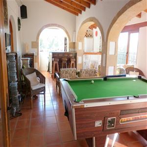 glazed naya with bar and pool table