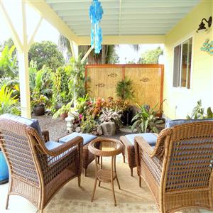 Oversized outdoor lounge seating with ottomans.