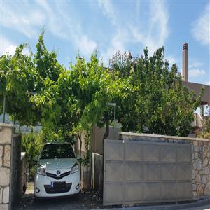 Garage with electric door.