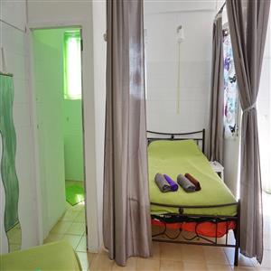 Double bed and bathroom