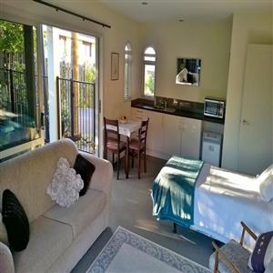 Studio bedroom showing dining/kitchen area